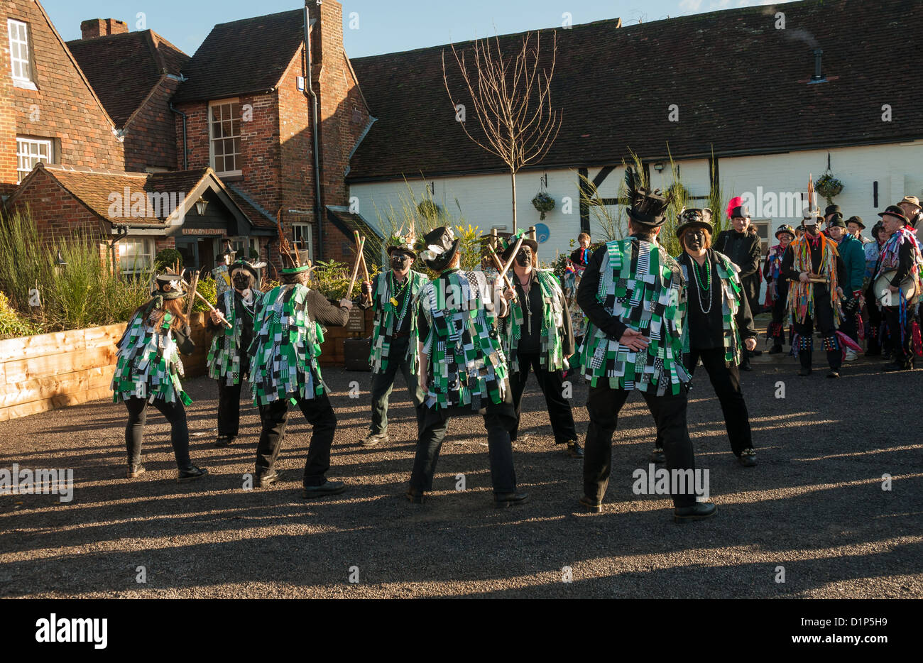 Bishops Waltham, Hampshire, England, January 1 2013. English Morris dancers in the village Square performing thier traditional m Stock Photo