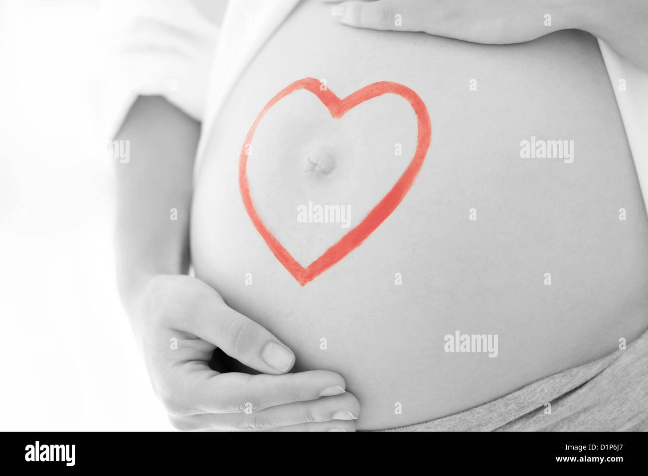 Pregnant woman's abdomen Stock Photo - Alamy