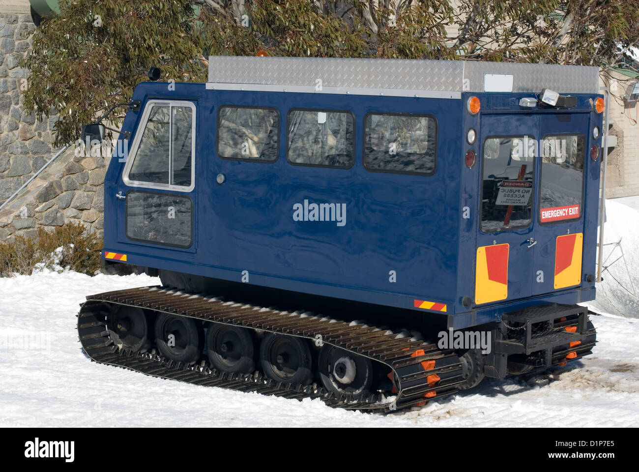 A snow transport vehicle parked outside a chalet at a resort in the Australian Alps Stock Photo