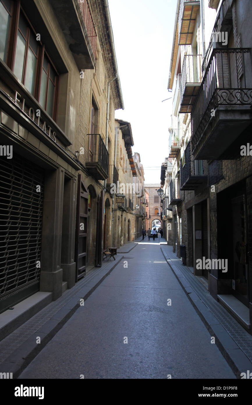 Narrow Spanish high street in shadow Stock Photo