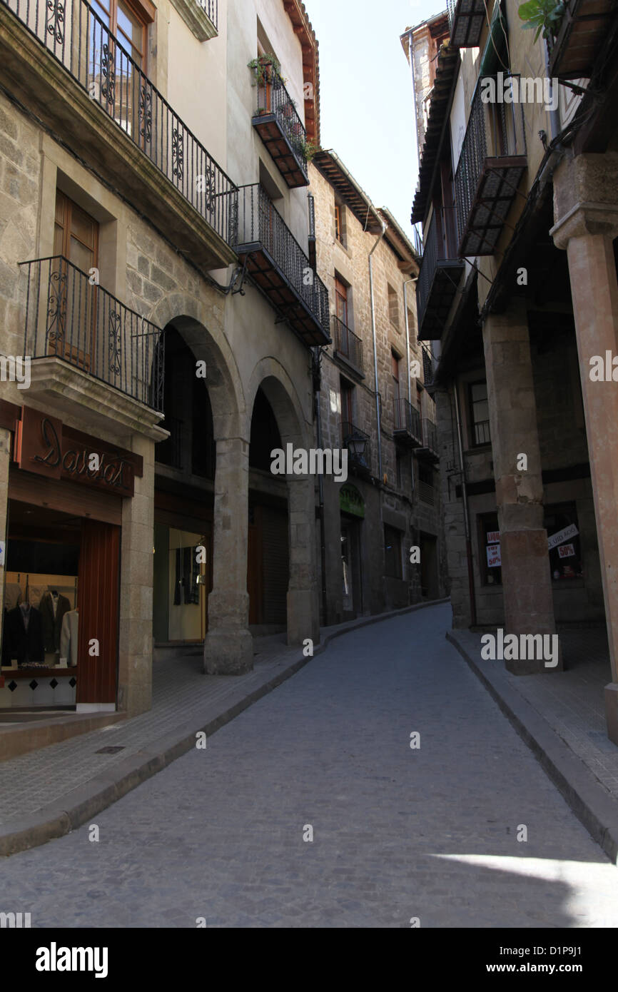Narrow Spanish back street in shadow Stock Photo