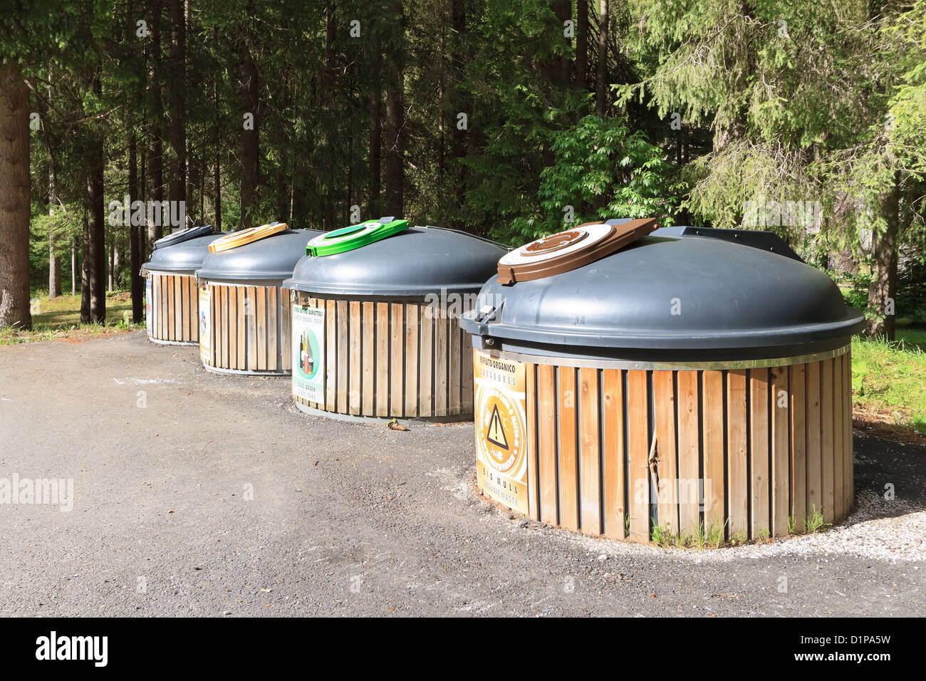 four wooden recycle bins for waste segregation Stock Photo Alamy