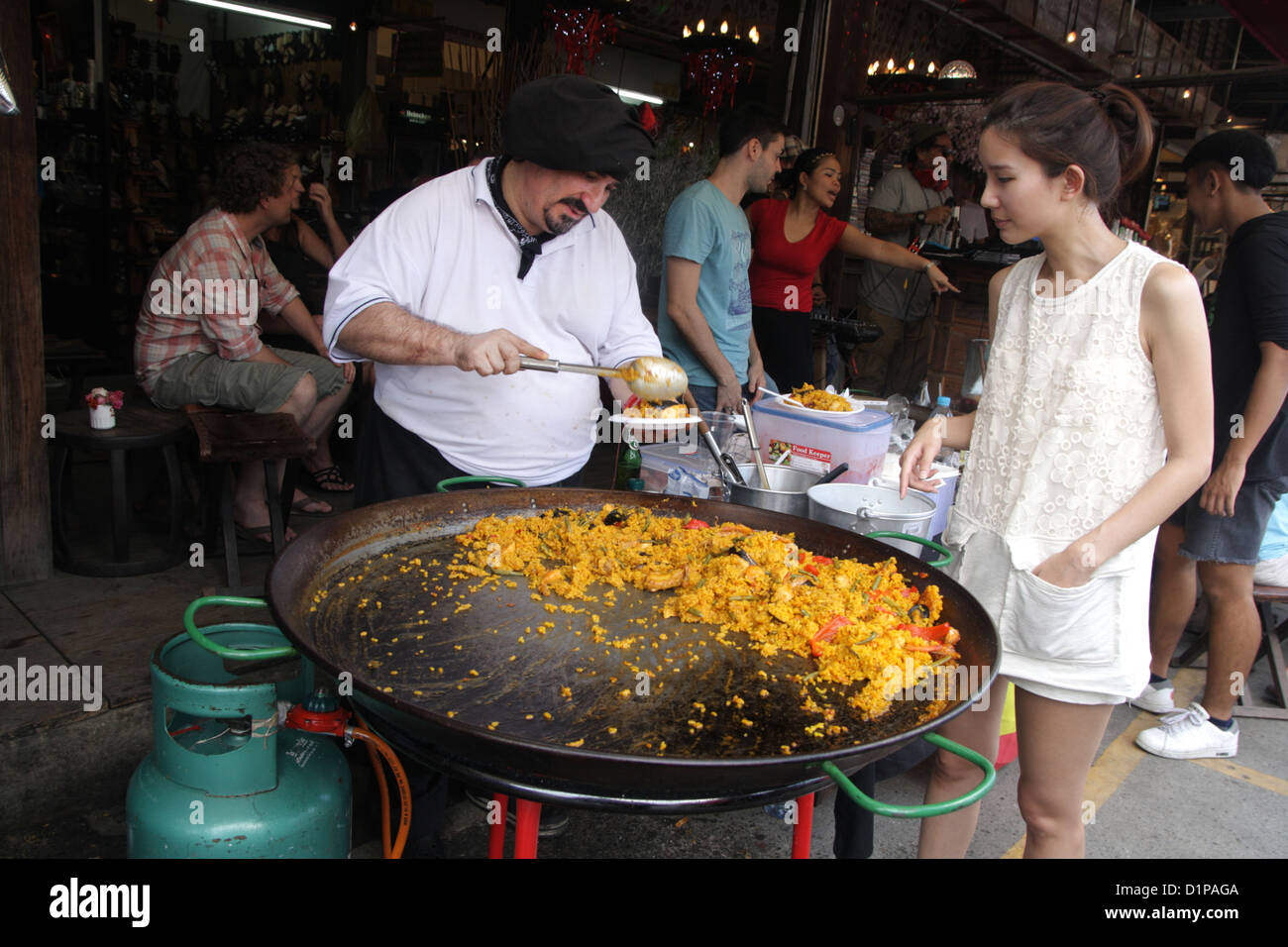 Chef serving Paella , Street restaurant at Chatuchak Weekend Market
