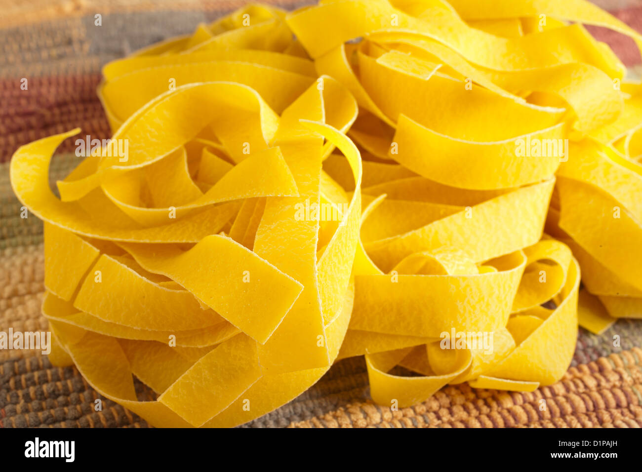Uncooked dry Pappardelle Stock Photo Alamy