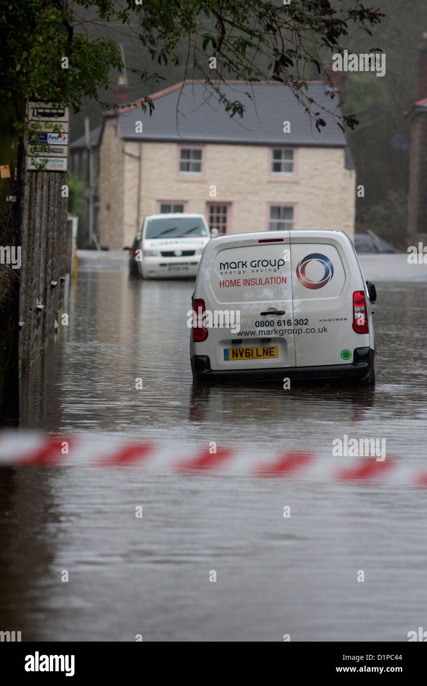 Cars surrounded by flood water in Helston caused by the River Cober bursting its banks Stock Photo