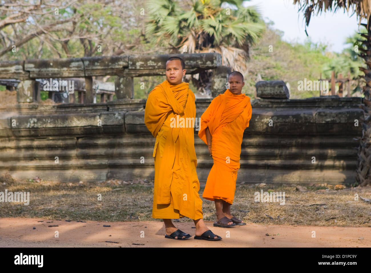 Monk at the temple of Angkor Wat, Cambodia Stock Photo