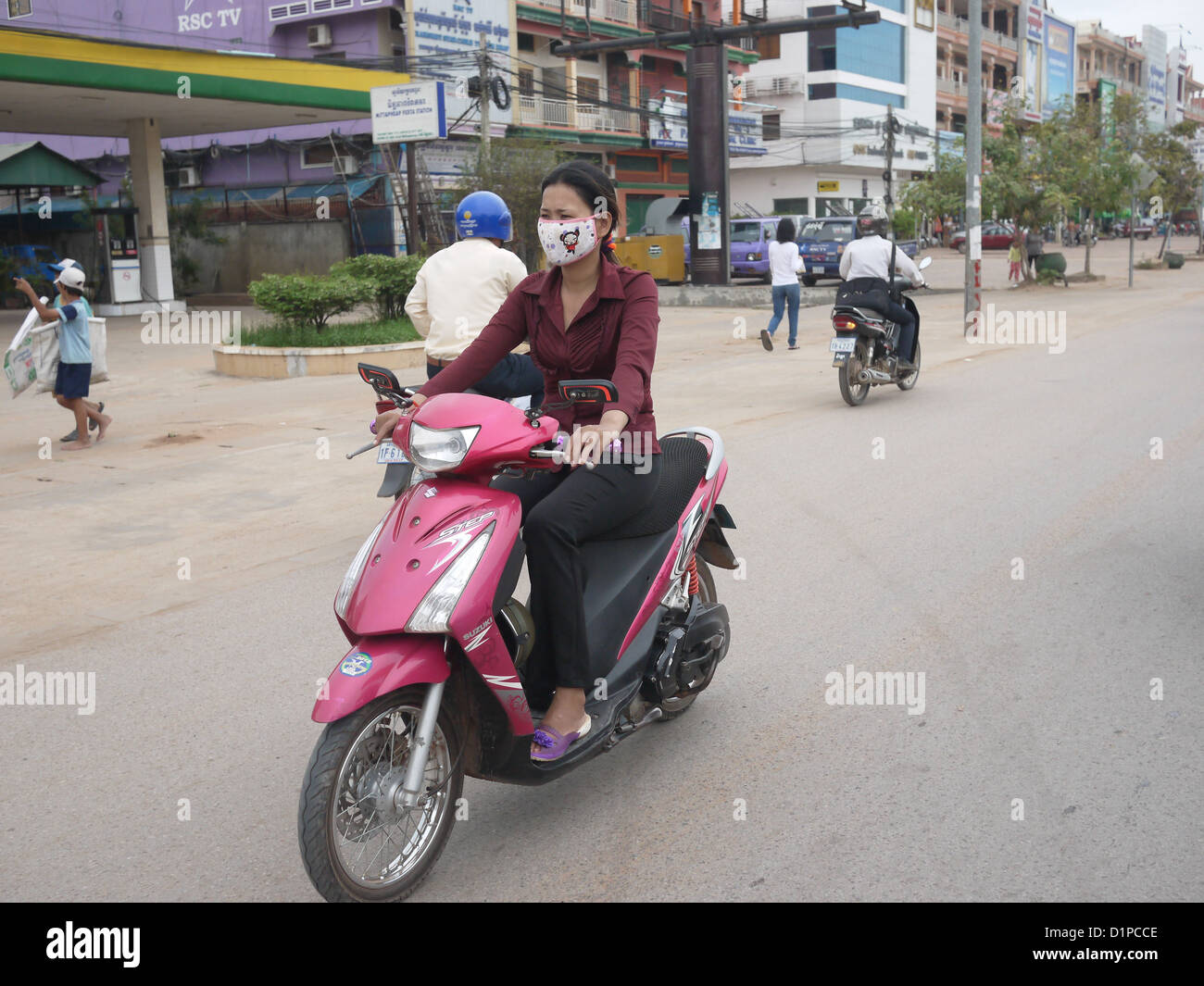 woman mouth mask riding scooter motorbike Cambodia Stock Photo - Alamy