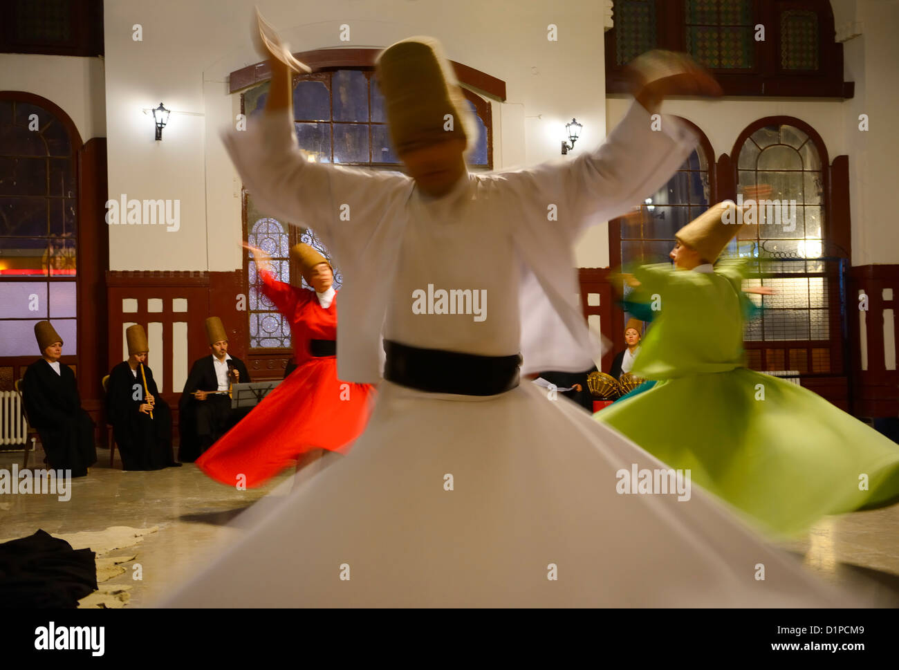 Whirling Dervish Sema Ceremony with musicians and women dancers Istanbul Turkey Stock Photo