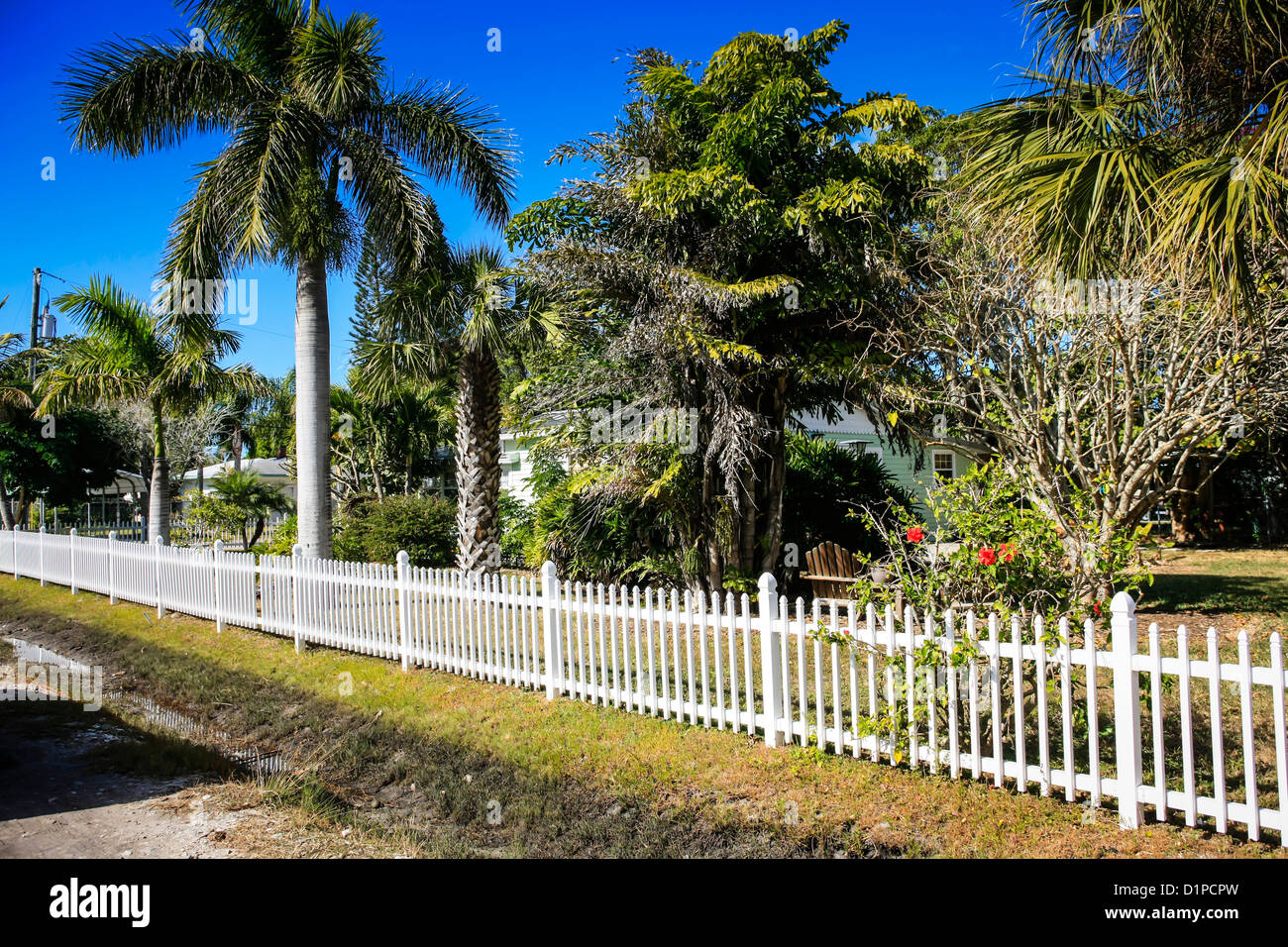 White picket fencing around the village of Cortez on Anna Maria Island FL Stock Photo