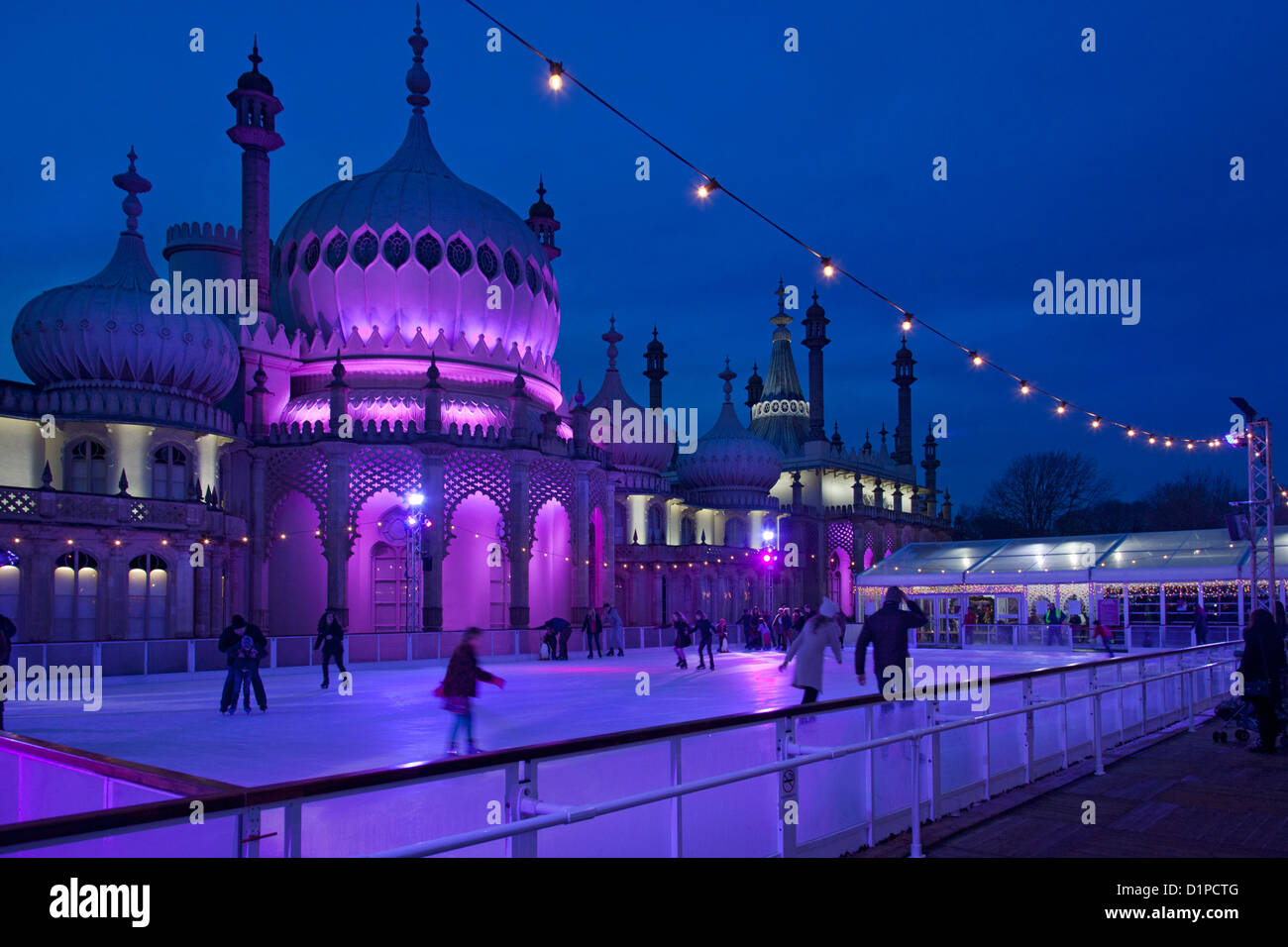 Brighton Royal Pavilion with winter ice skating rink and skaters at
