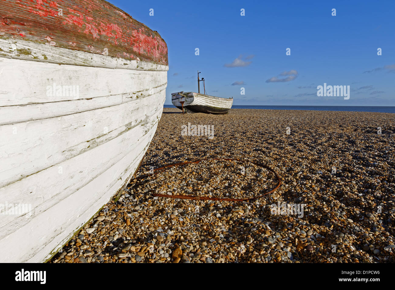 Old fishing boats on a shingle beach - Aldeburgh,Suffolk,UK Stock Photo ...