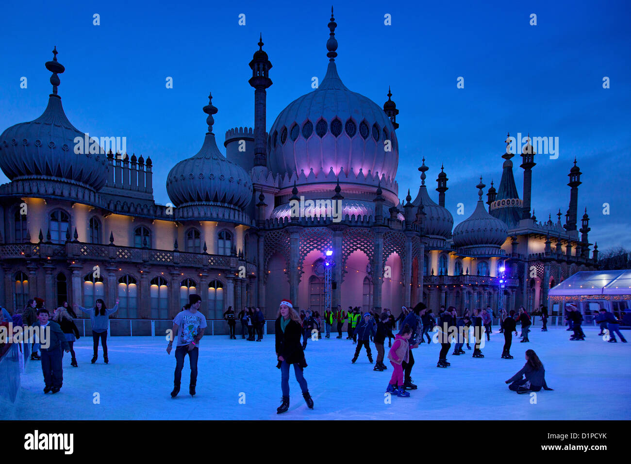Brighton Royal Pavilion with winter ice skating rink and skaters at