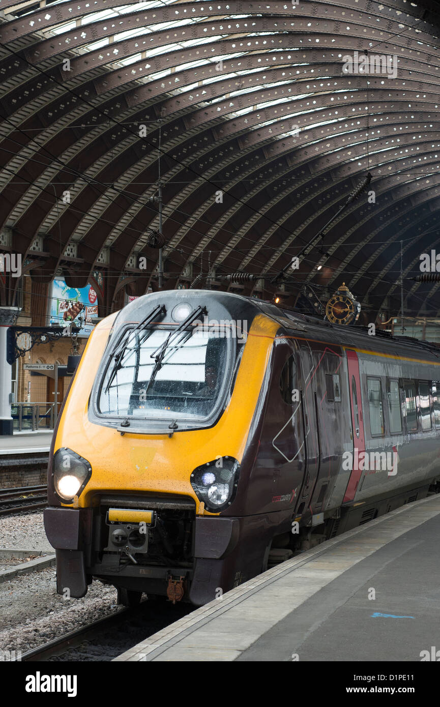 Class 220 Voyager passenger train in CrossCountry livery waiting at a platform at York Railway Station, England. Stock Photo