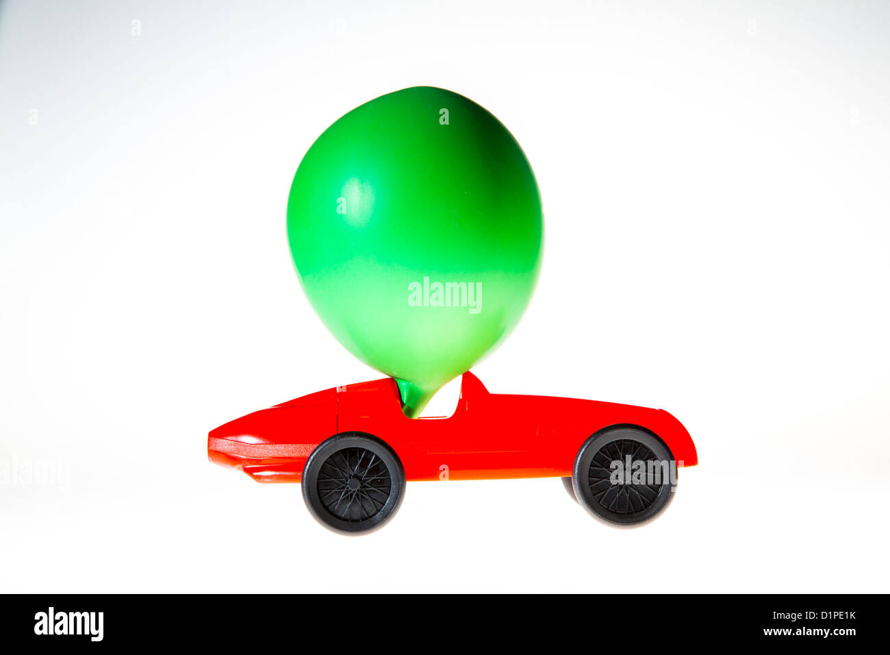Toy car, powered by the air of a blown up balloon. The effluent air ...