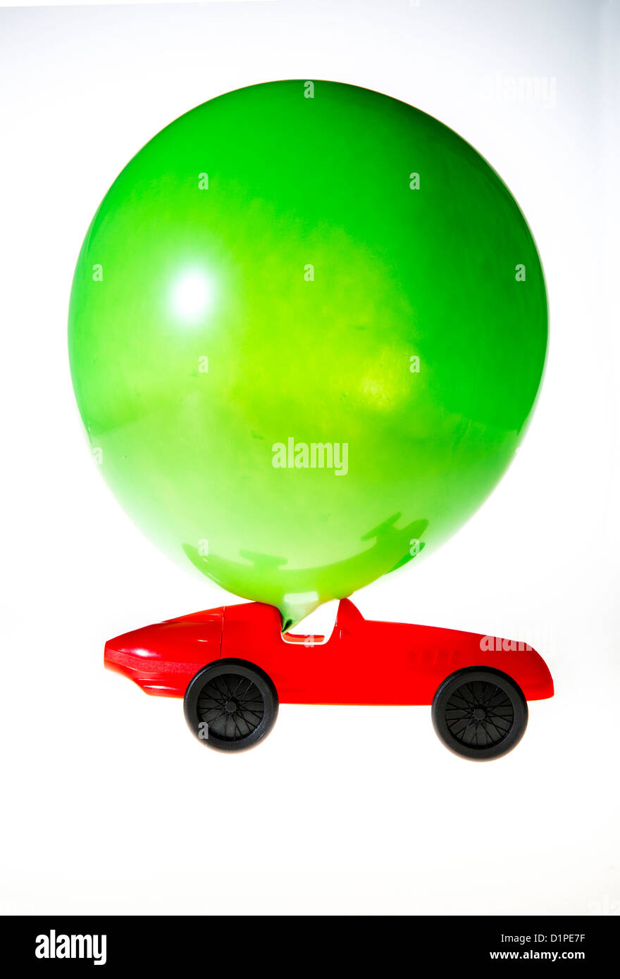 Toy car, powered by the air of a blown up balloon. The effluent air ...