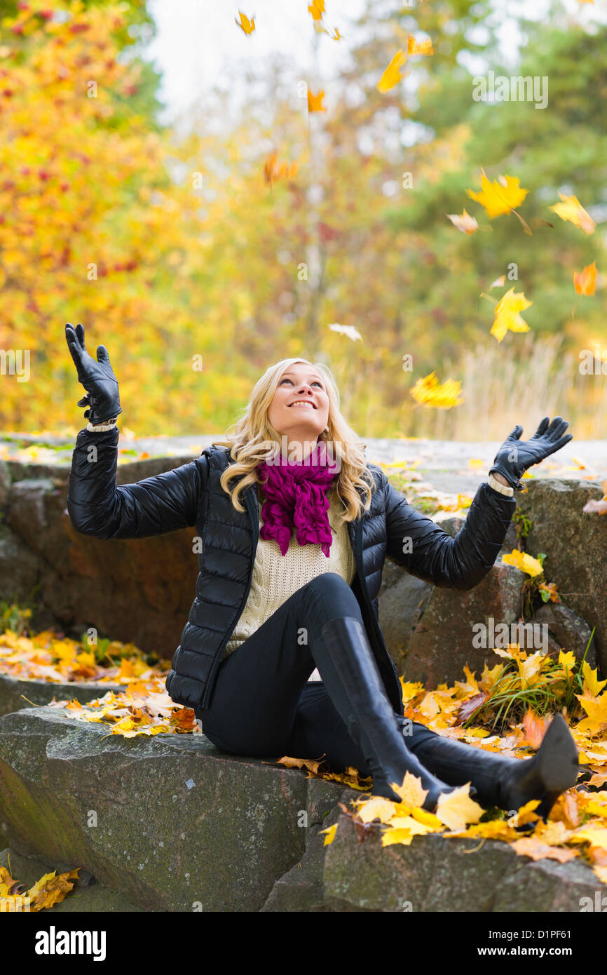 Beautiful girl and falling leaves, autumn color Stock Photo