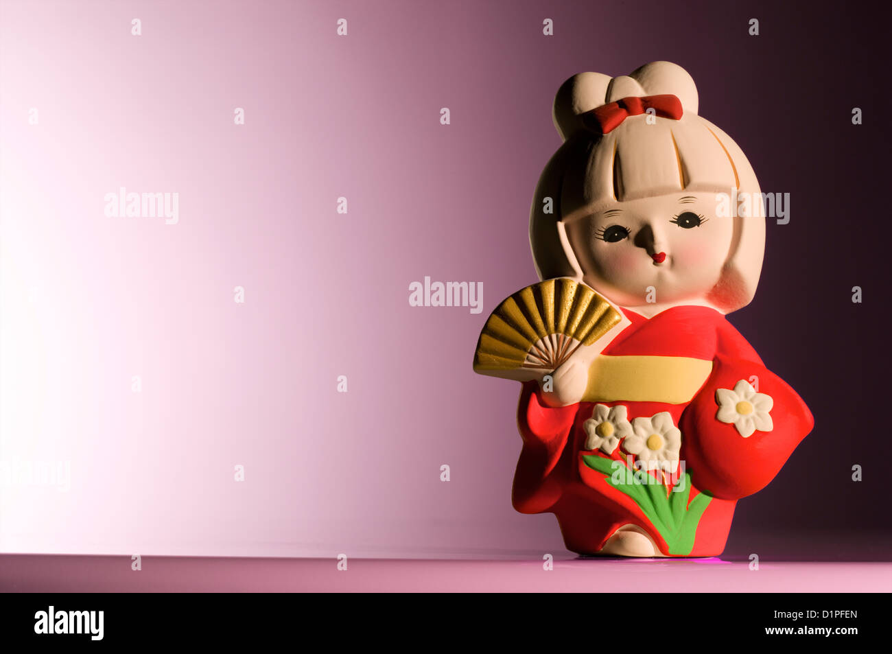 Japanese figurine wearing a Kimono Stock Photo