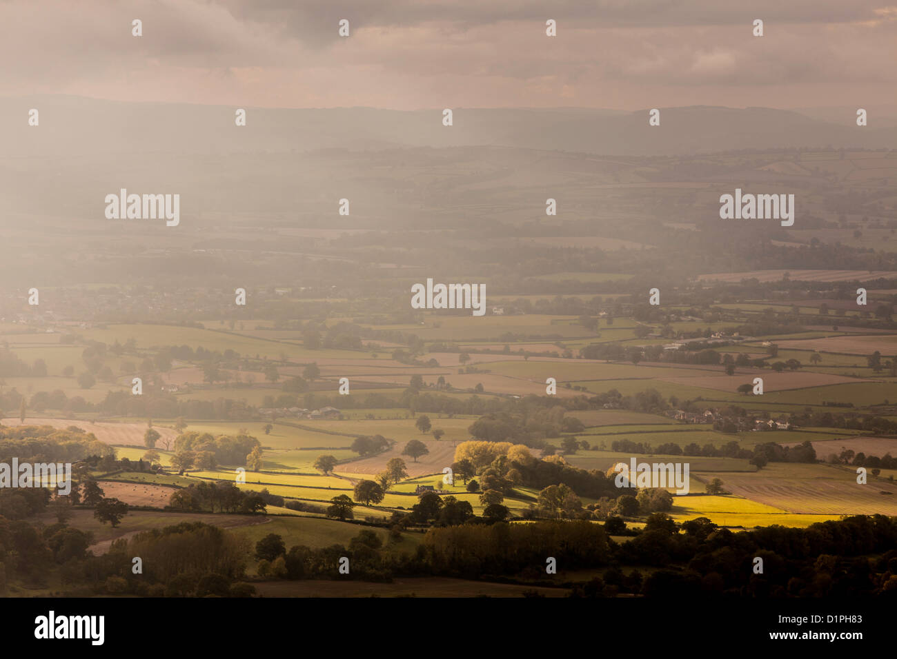 A shaft of late afternoon autumn light falls over Shropshire countryside near Ludlow, Shropshire, England UK Stock Photo