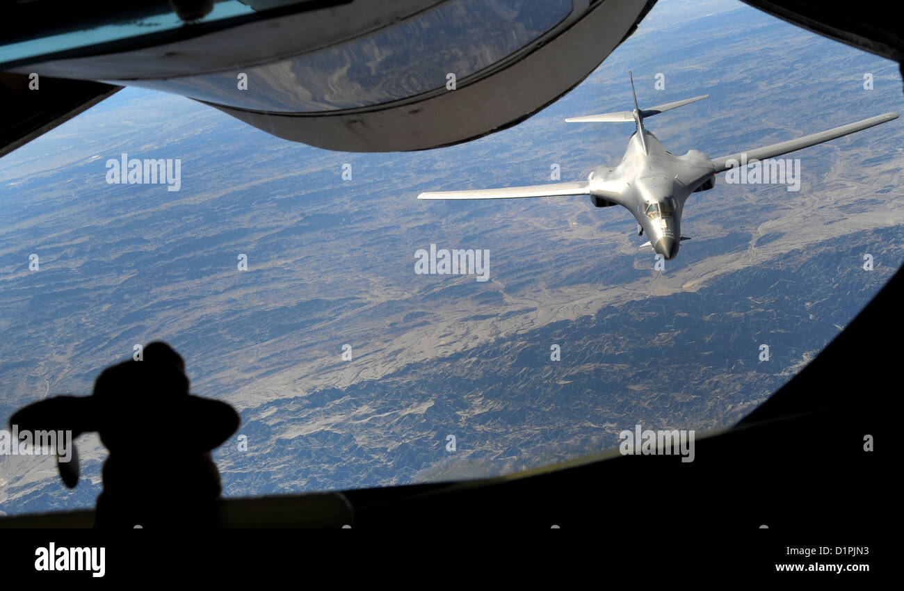 A 340th Expeditionary Air Refueling Squadron KC-135 Stratotanker prepares to refuel a B-1B Lancer over Afghanistan, Dec. 22. The B-1B, deployed from Ellsworth Air Force Base, S.D., flew 26 U.S. flags over Afghanistan for the Sandy Hook Elementary School s Stock Photo