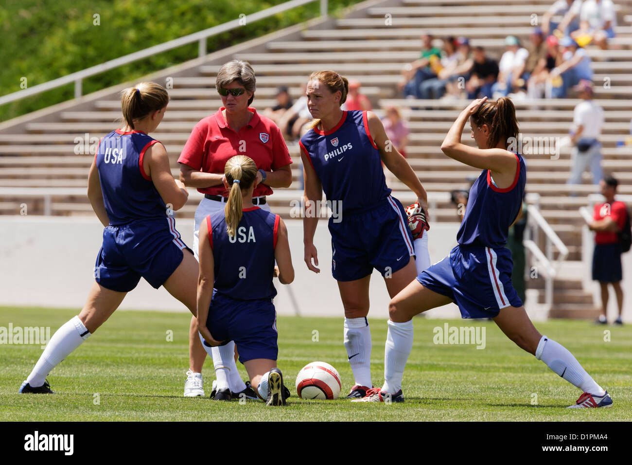 United States National Team head coach April Heinrichs talks with her players during warmups before a soccer match v. Mexico. Stock Photo