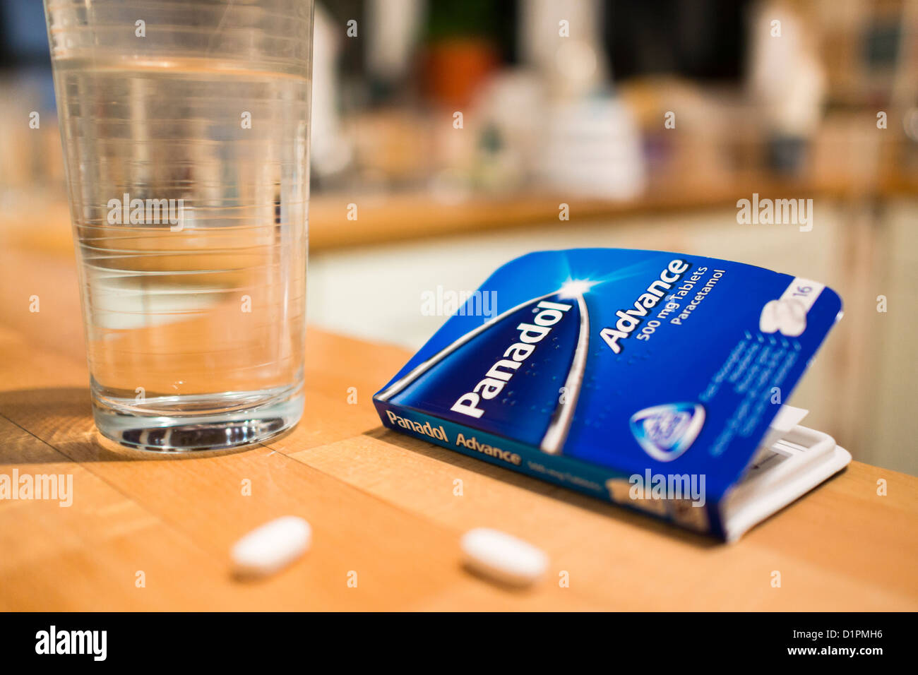 Painkillers and water to cure a headache Stock Photo Alamy