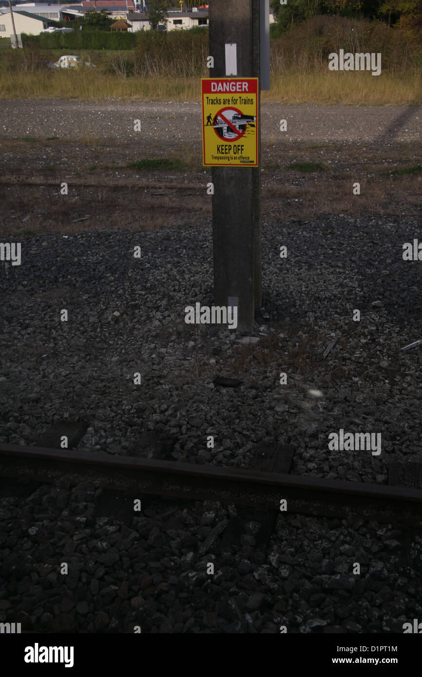 A sign warns people to stay away from the railway tracks Stock Photo ...