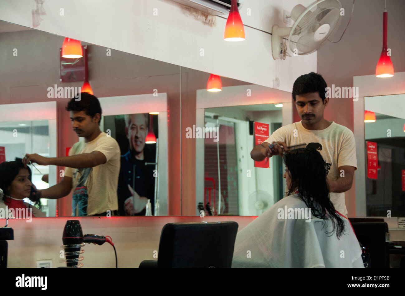 Woman getting hair cut in a Hair beauty  salon, India Stock Photo