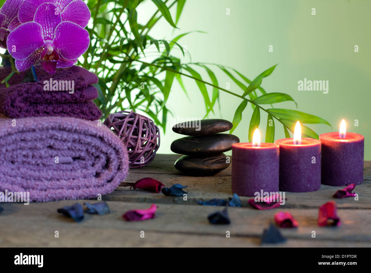 Spa still life with zen stones aromatic candles and orchid Stock Photo