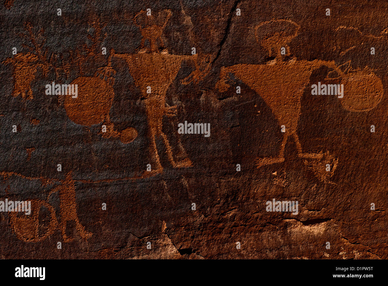 Horned anthropomorphs holding shields, Formative Period Petroglyphs, Utah Scenic Byway 279, Potash Road, Rock Art Sites, Moab, Stock Photo