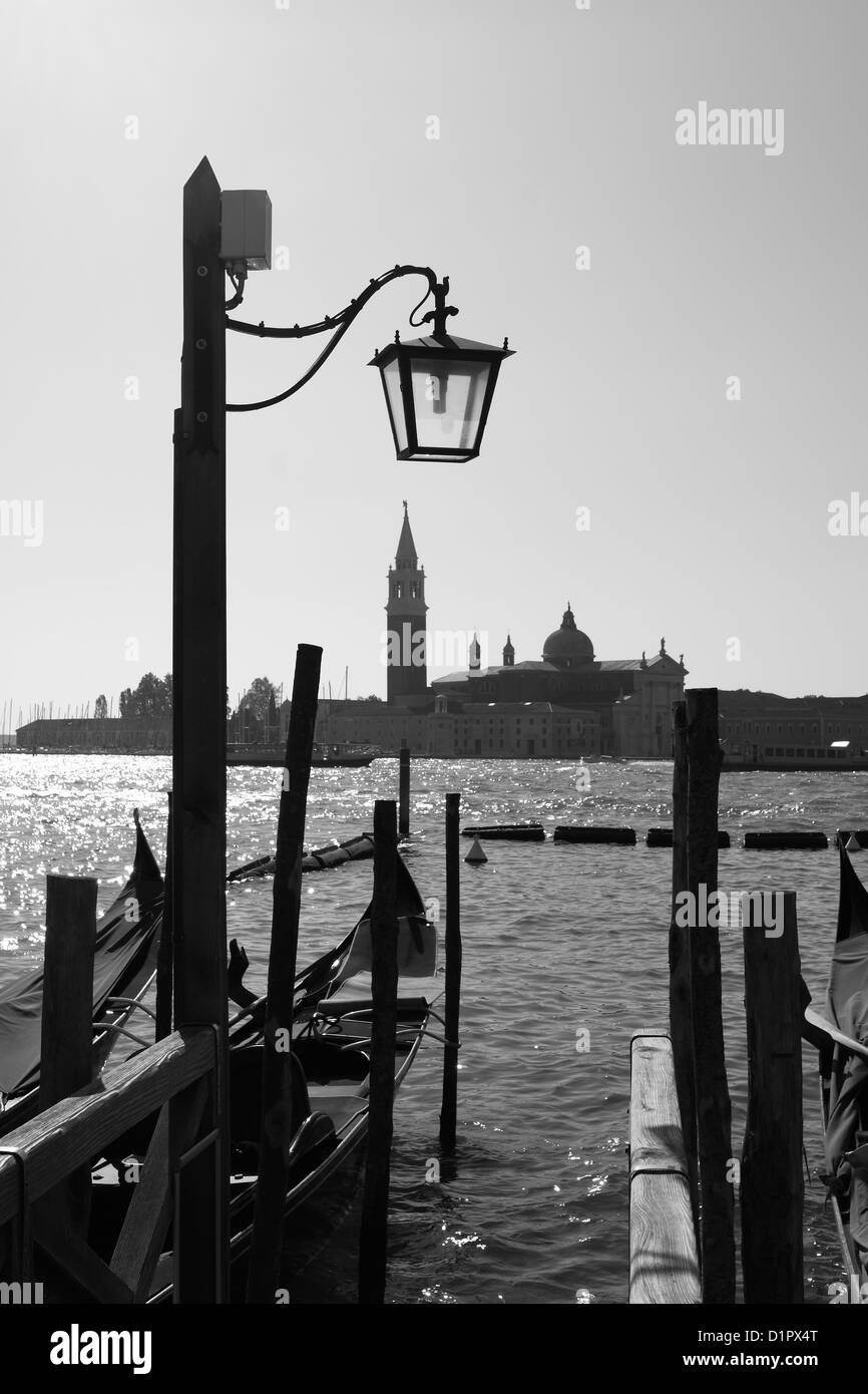 Gondolas and the water front at Venice, Italy, looking towards the campanile of the church of San Giorgio Maggiore Stock Photo