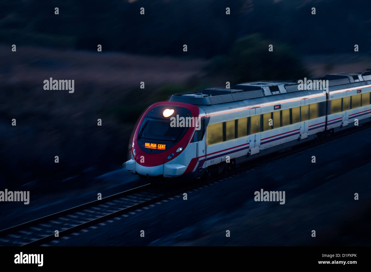Night train speeding through the Spanish countryside Stock Photo