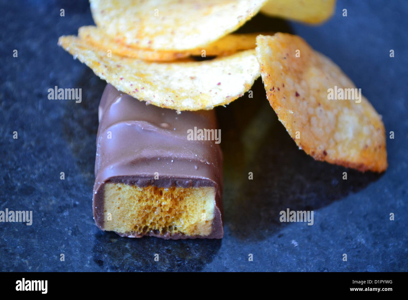 Chocolate with a side order of chips. Stock Photo