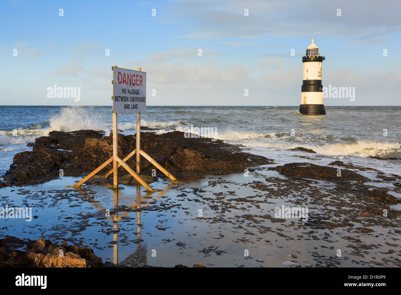 Danger sign warning of no access to Black Nose lighthouse offshore at Penmon Point (Trwyn Du), Isle of Anglesey (Ynys Mon), North Wales, UK, Britain Stock Photo