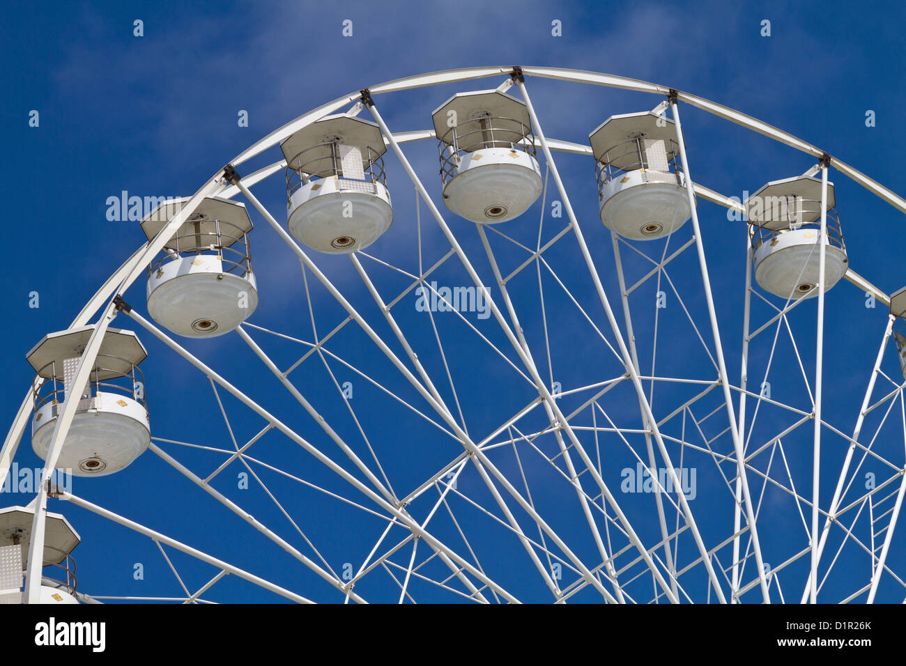 Big wheel or Ferris wheel, fairground ride with a blue sky. Stock Photo