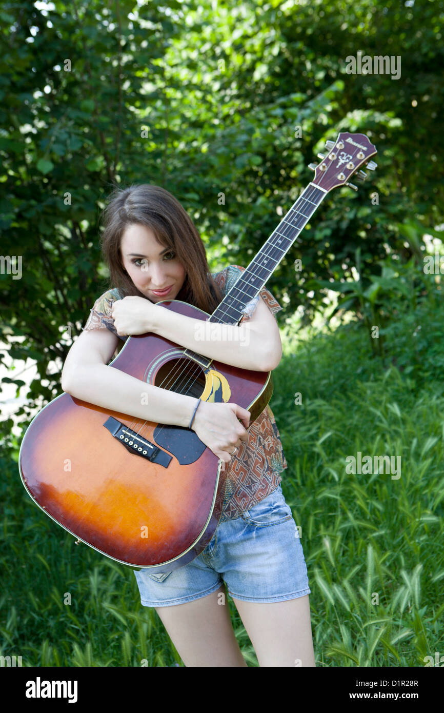 young woman with guitar Stock Photo - Alamy