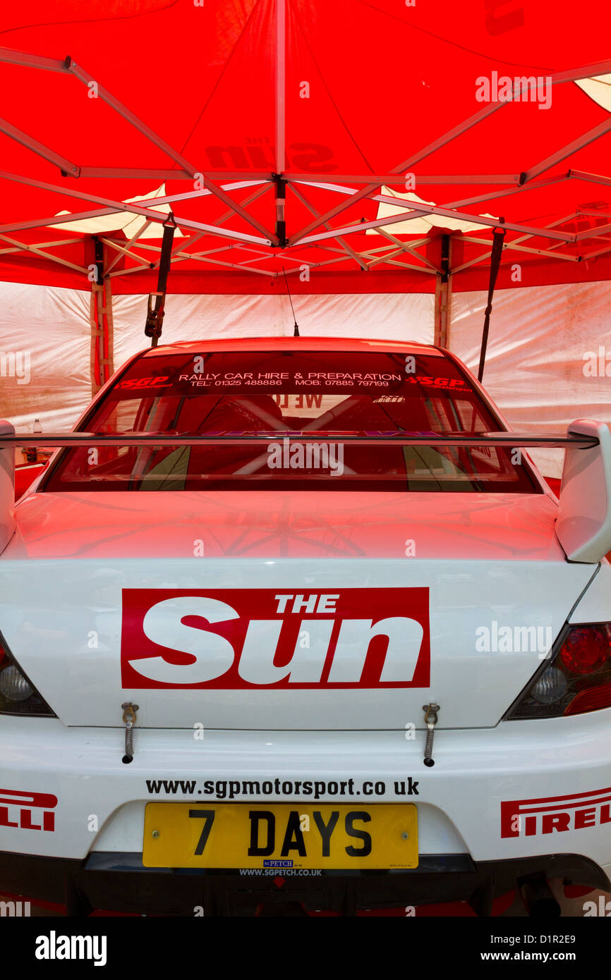 A Sun sponsored SGP Motorsport rally car under cover at the 2012 Goodwood Festival of Speed, Sussex, UK. Stock Photo