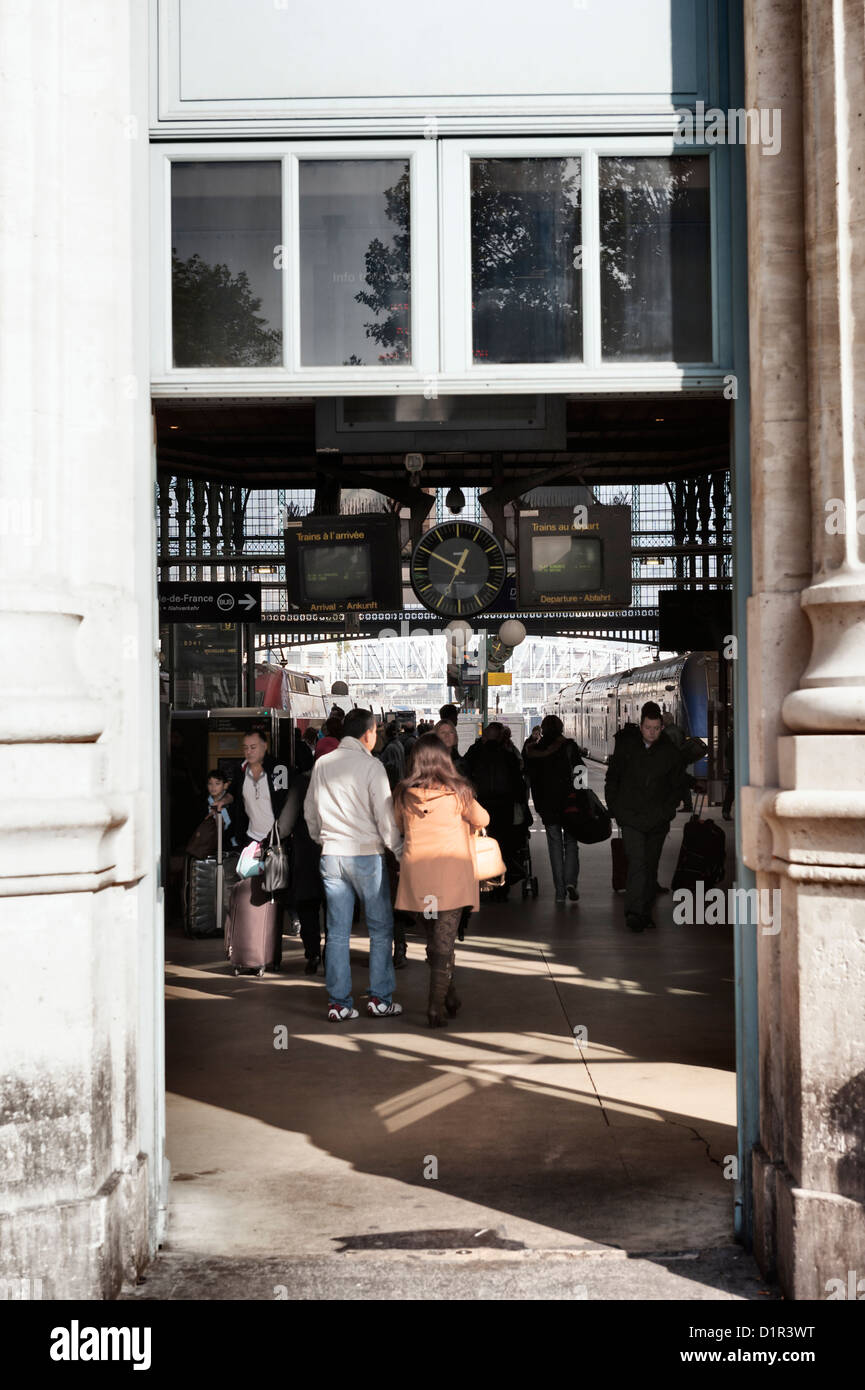 Paris, France: Passengers under a railway station clock at Gare Du Nord Stock Photo
