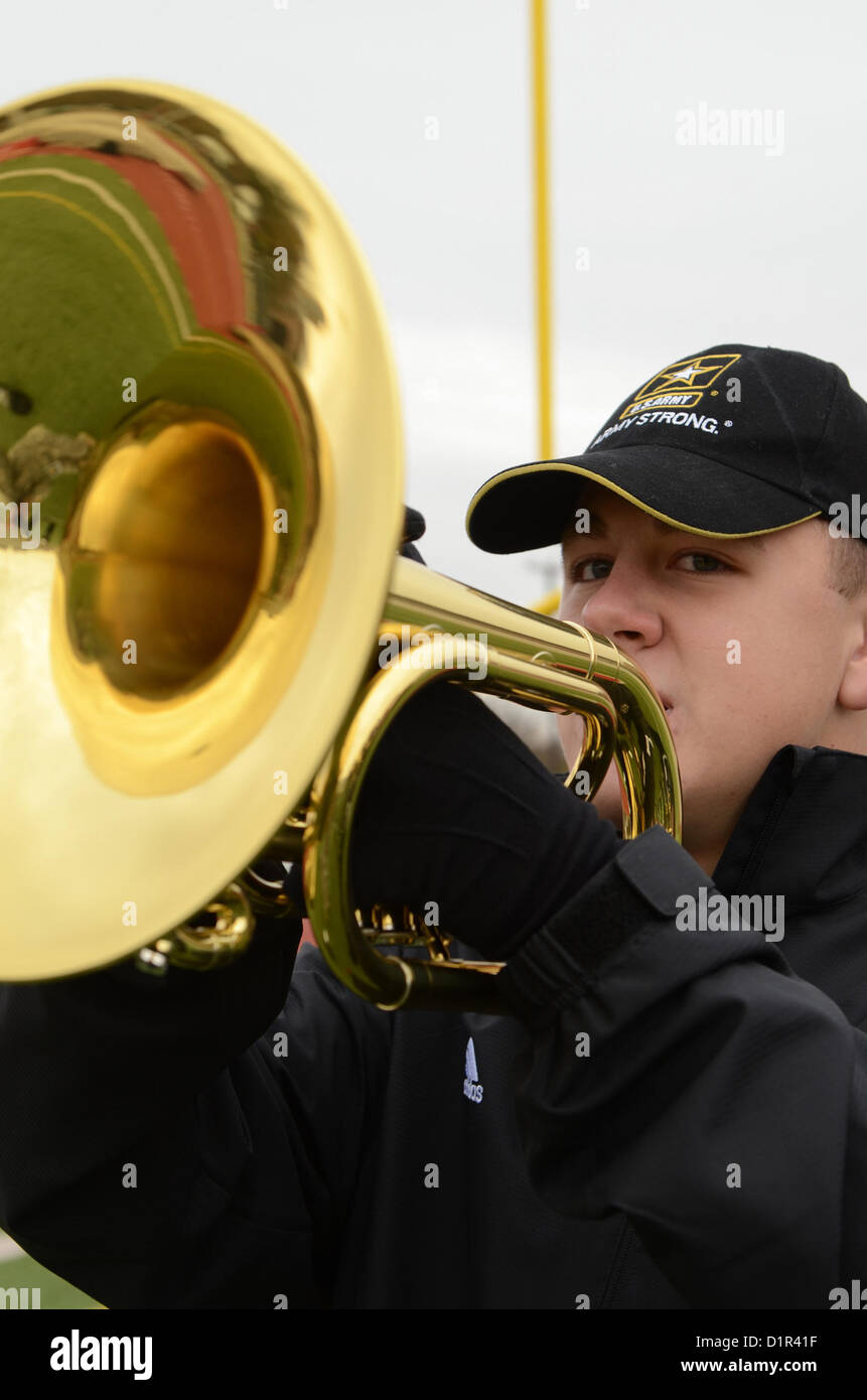 Joseph Baldwin plays french horn for the U.S. Army All-American Band on Benson Field in San Antonio on Jan. 2, 2013. Baldwin is a part of the U.S. Army All-American Band scheduled to play at the U.S. Army All-American Bowl. (U.S. Army photo by Pfc. Victor Blanco, 205th Public Affairs Operations Center) Stock Photo