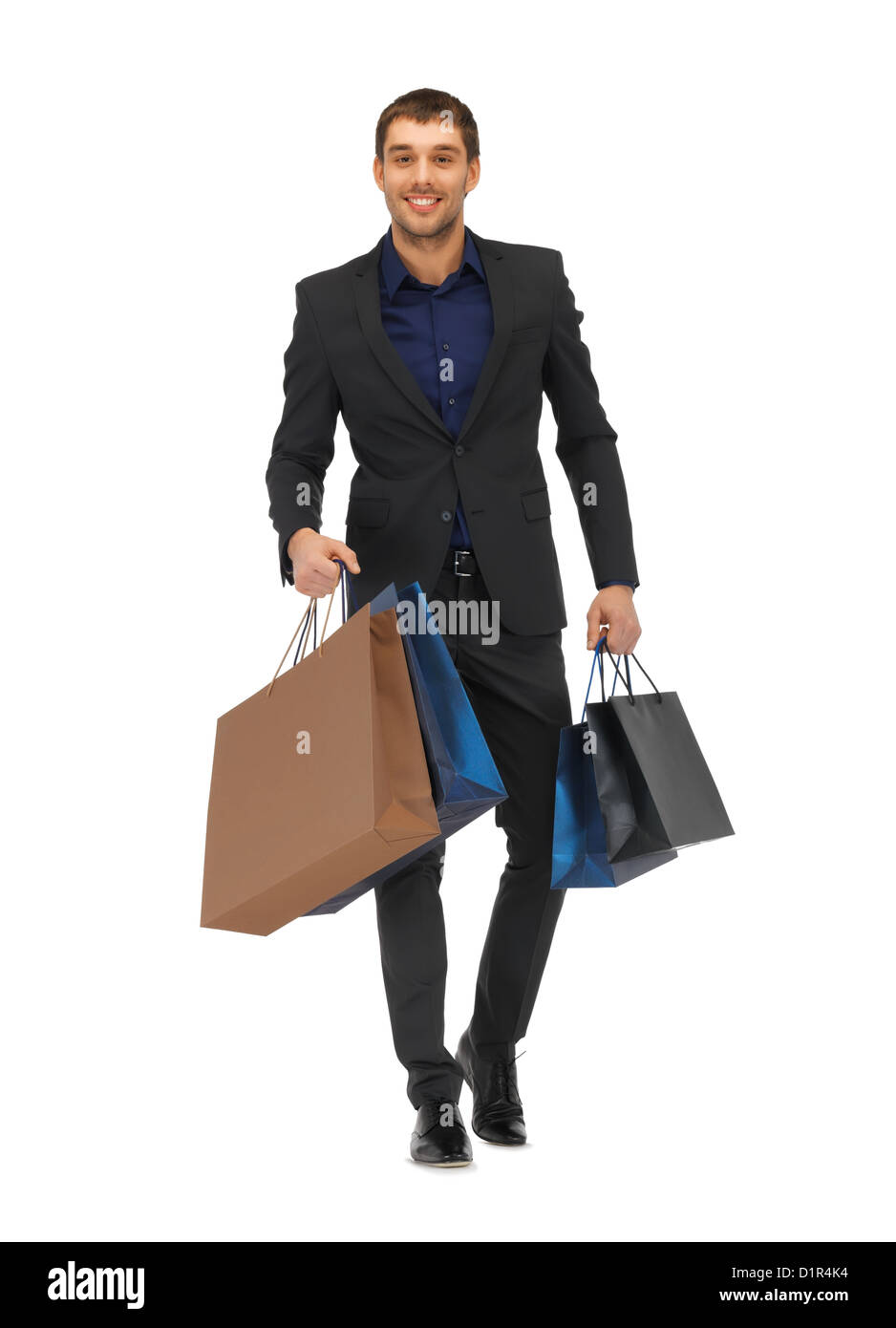 handsome man in suit with shopping bags Stock Photo