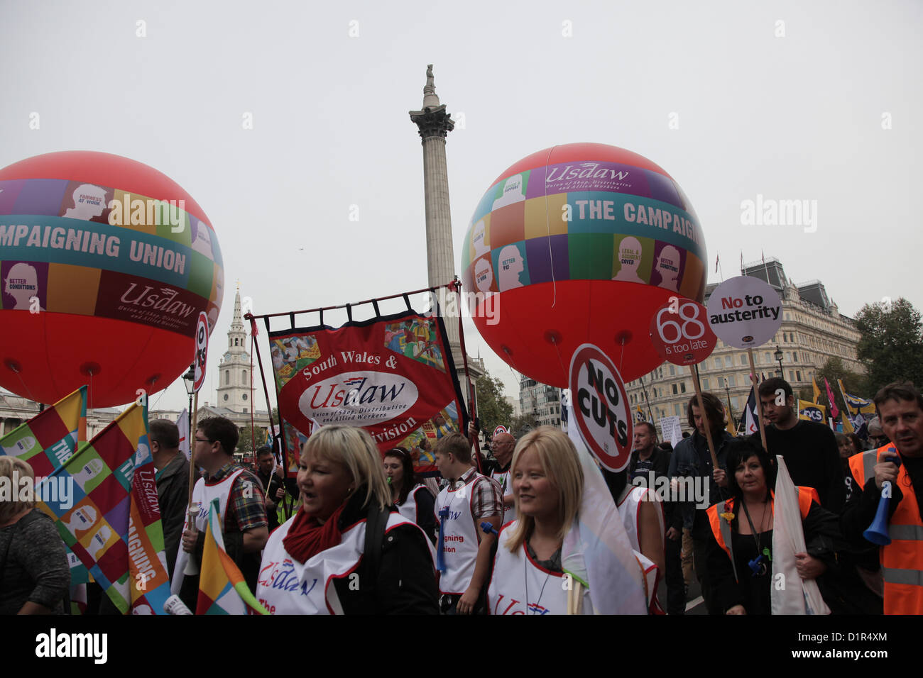 The demonstration moves through Trafalgar Square. 10s of thousands turned out to demonstrate against the Government's cuts. Stock Photo