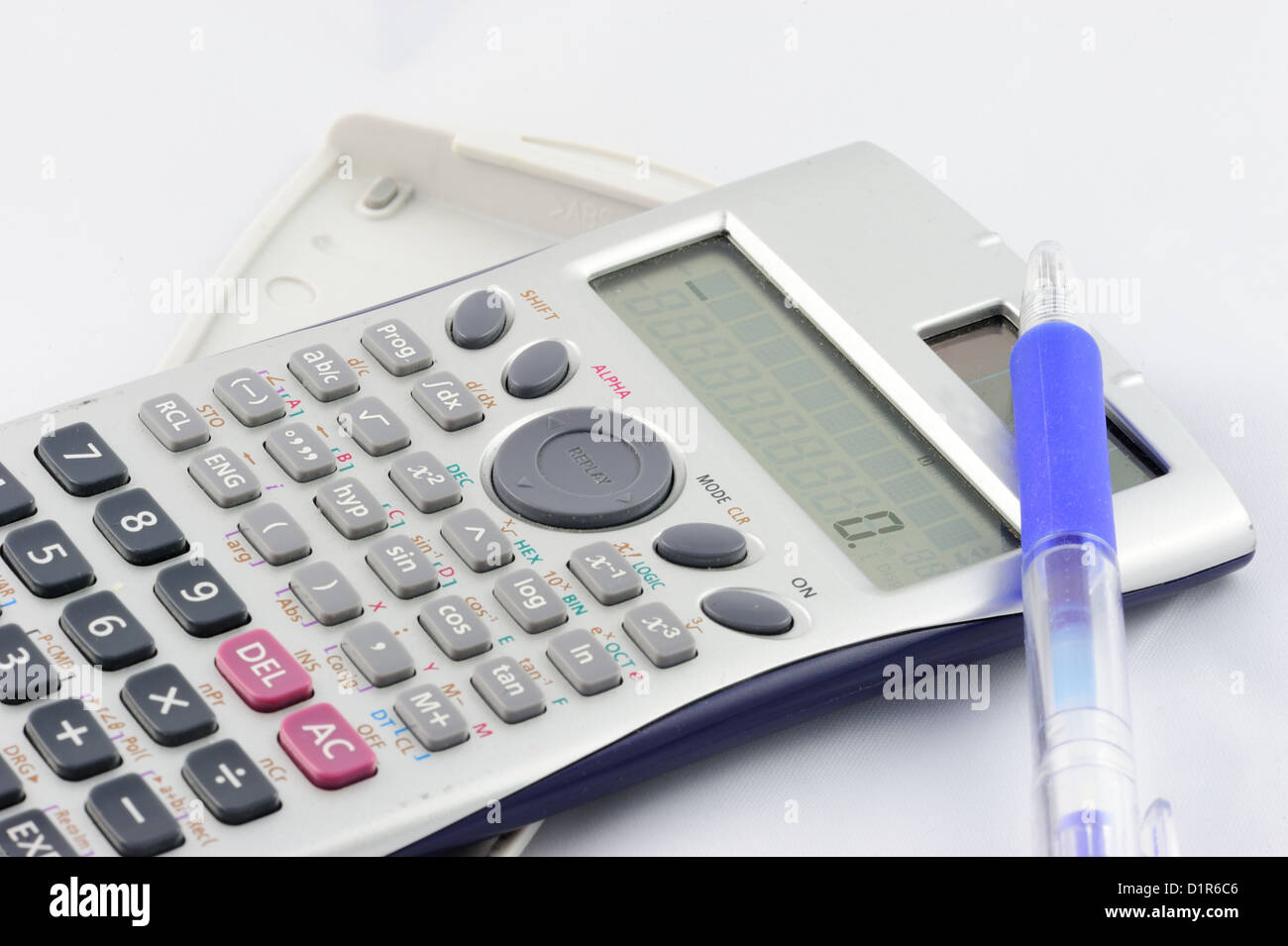 Isolated calculator and pen on white background Stock Photo - Alamy