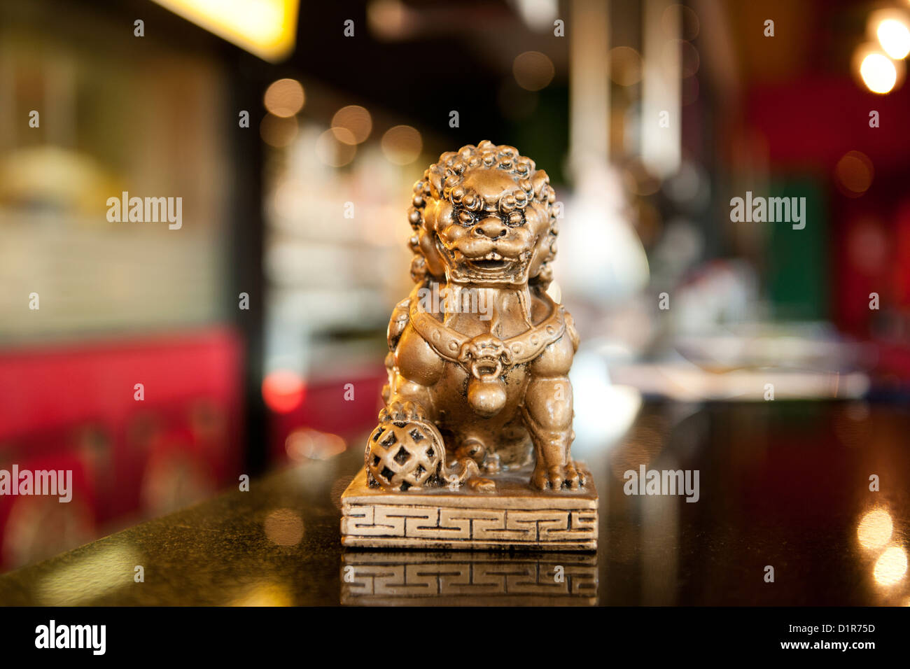 small chinese lion statue in a china restaurant Stock Photo
