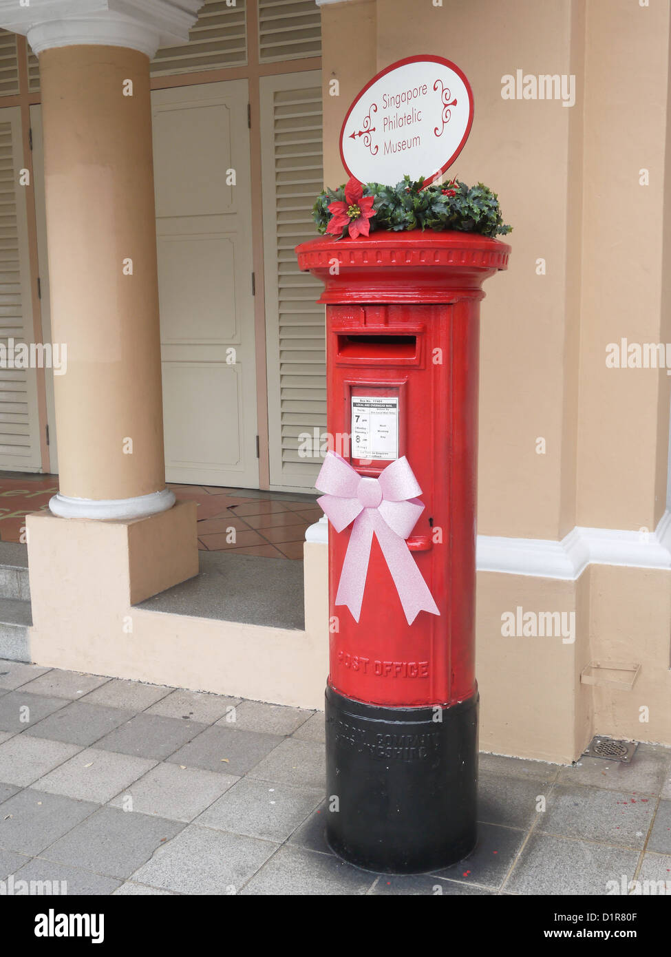 traditional british red post box in singapore Stock Photo