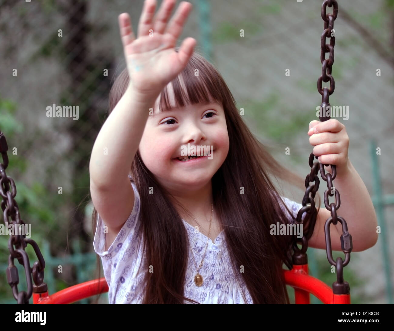 Portrait of beautiful young girl on the playground Stock Photo - Alamy