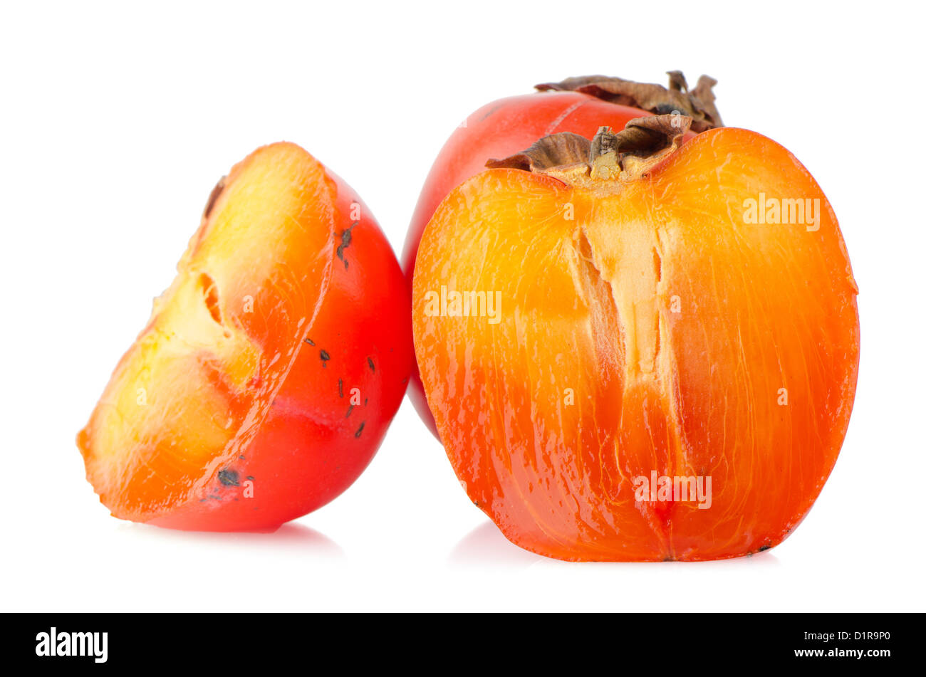 Ripe persimmons on white background Stock Photo - Alamy