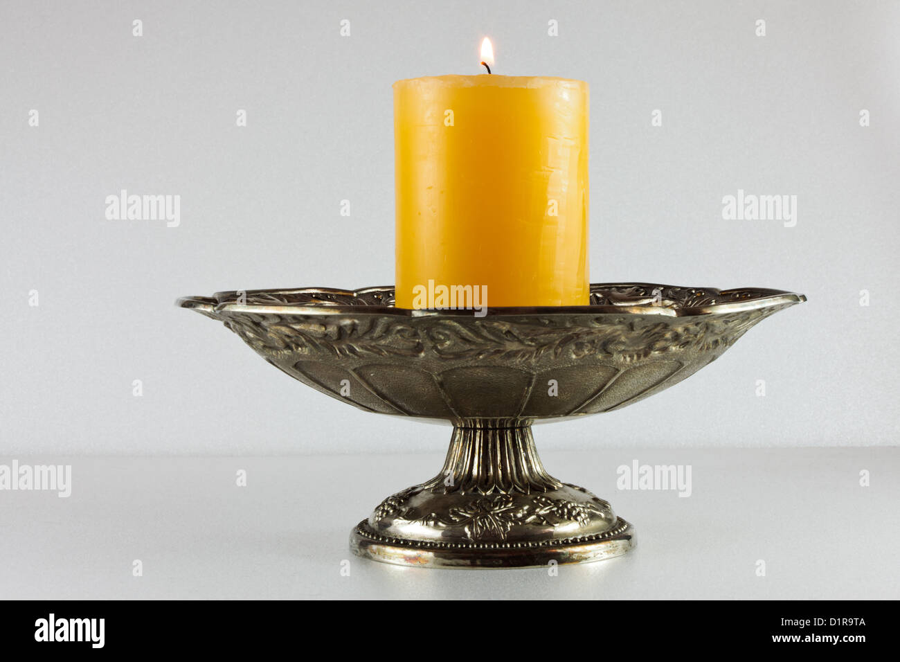 Burning, orange candle Stock Photo Alamy