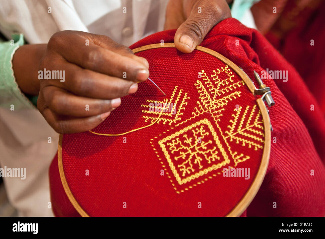 Morocco, Ouarzazate, Woman making embroidery. Stock Photo