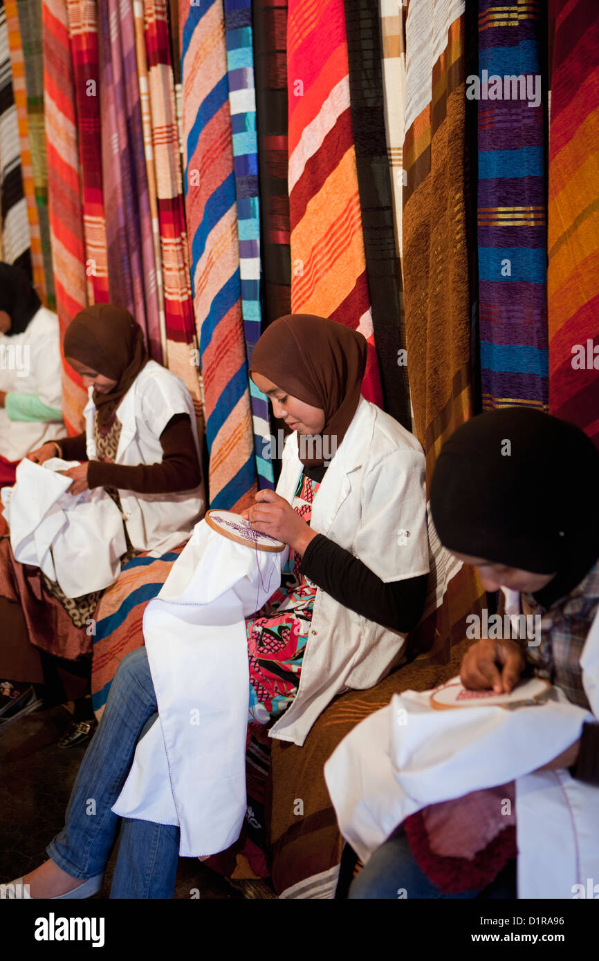 Morocco, Ouarzazate, Women making embroidery. Stock Photo
