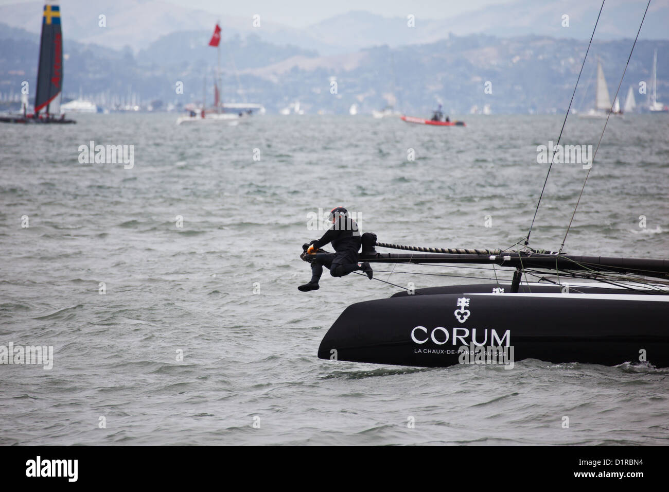 One French Team Corum member, makes adjustments during Louis Vuitton Cup race in Americas Cup Series in San Francisco, CA, USA Stock Photo