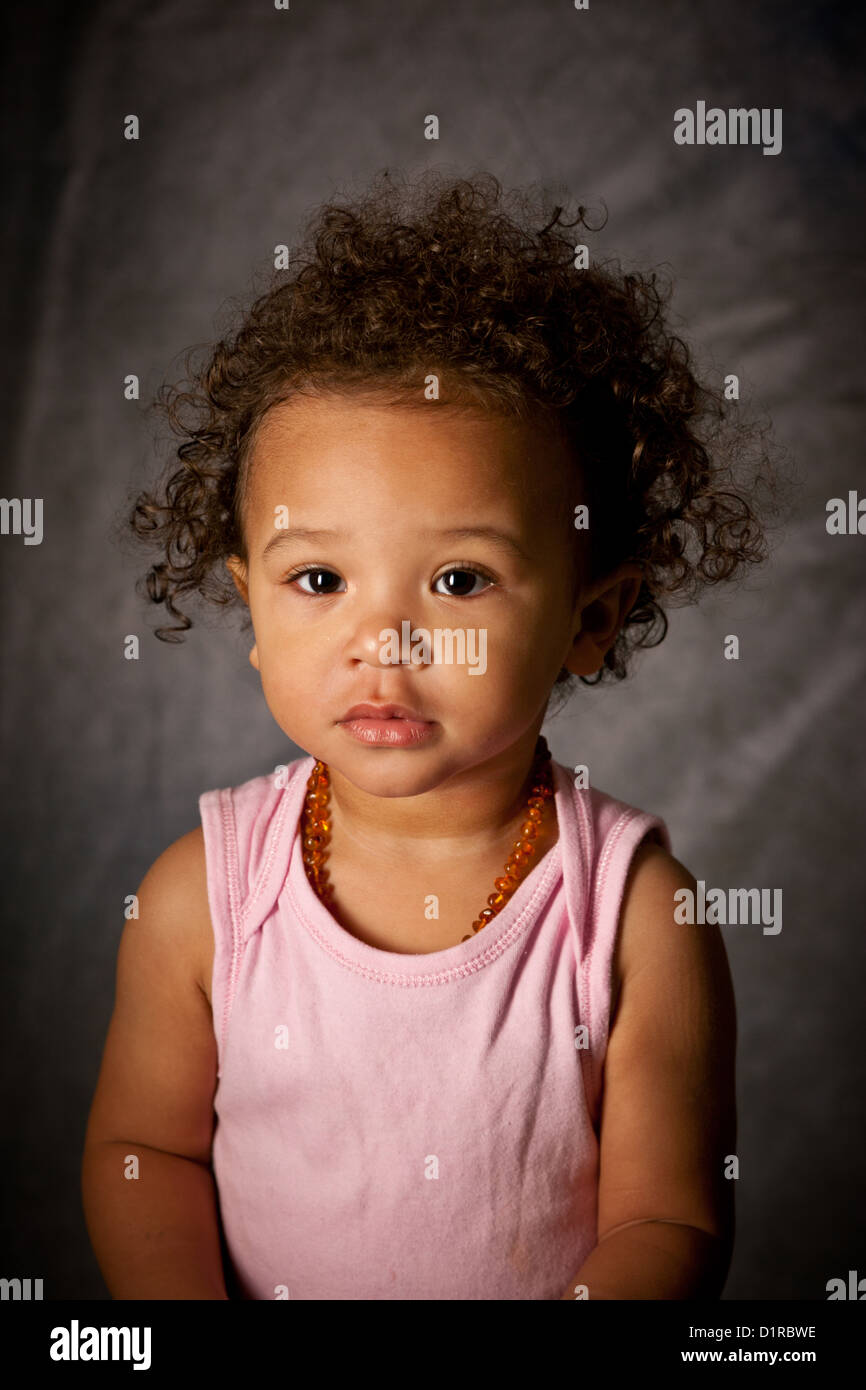 Studio portrait of a cute baby girl, 18 months, mixed race Stock ...